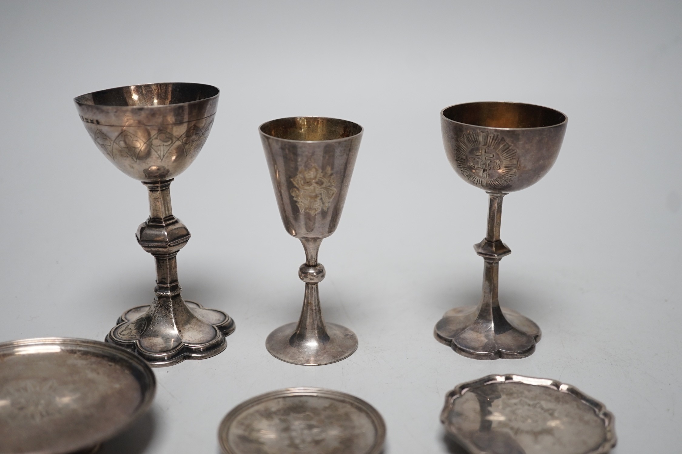 Three Victorian silver communion chalices, largest Thomas Thomason & Co, Birmingham, 1867, 10.1cm, Rawlings & Summers, London, 1854 and Josiah Williams & Co, London, 1889, together with three Victorian silver patens, lar